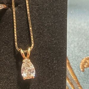 10K diamond solitaire necklace. Pear diamond